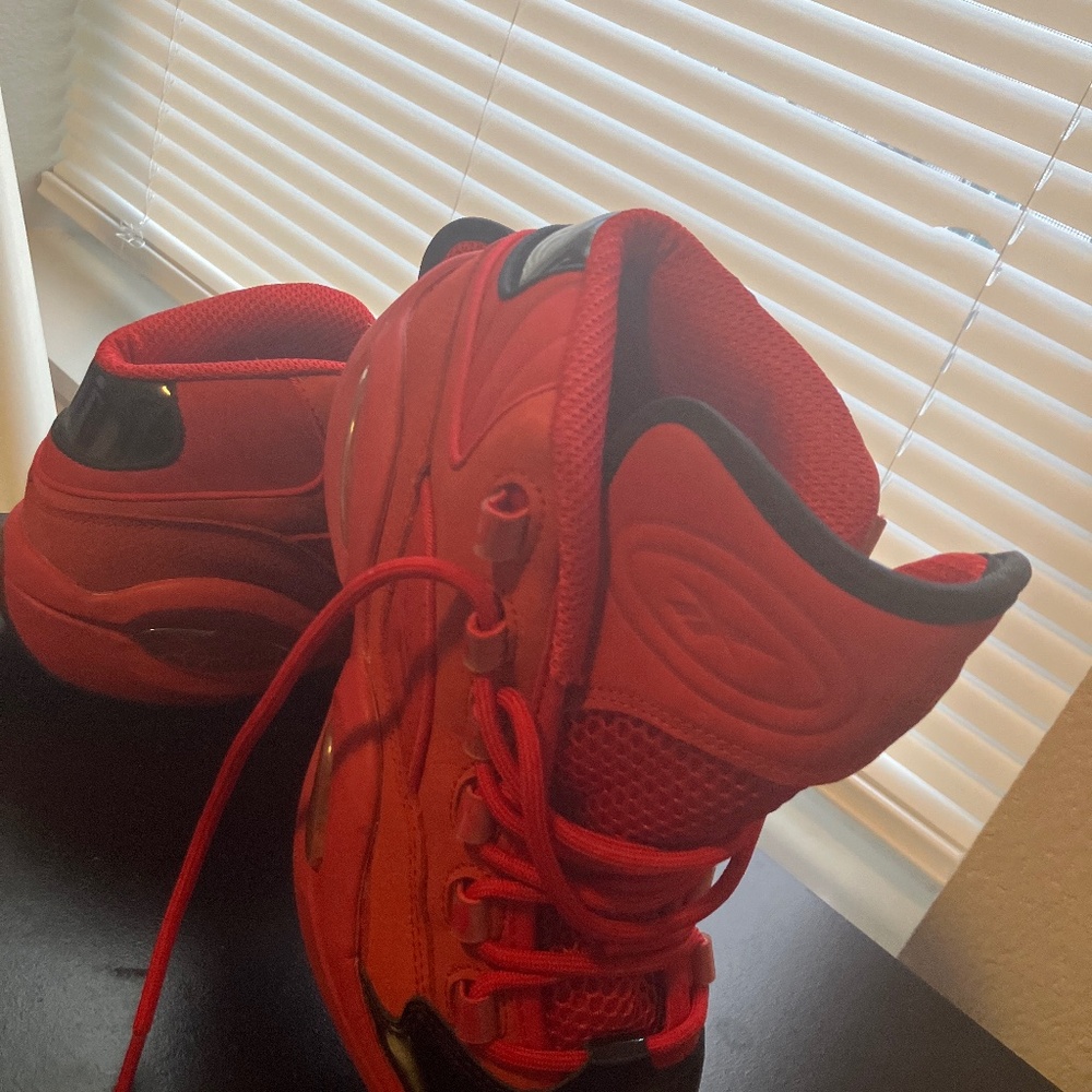 Red and black Reebok shoes.